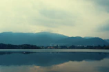 Wide-angle view of a serene landscape with muted colors and balanced composition.
