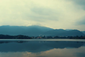 Wide-angle view of a serene landscape with muted colors and balanced composition.