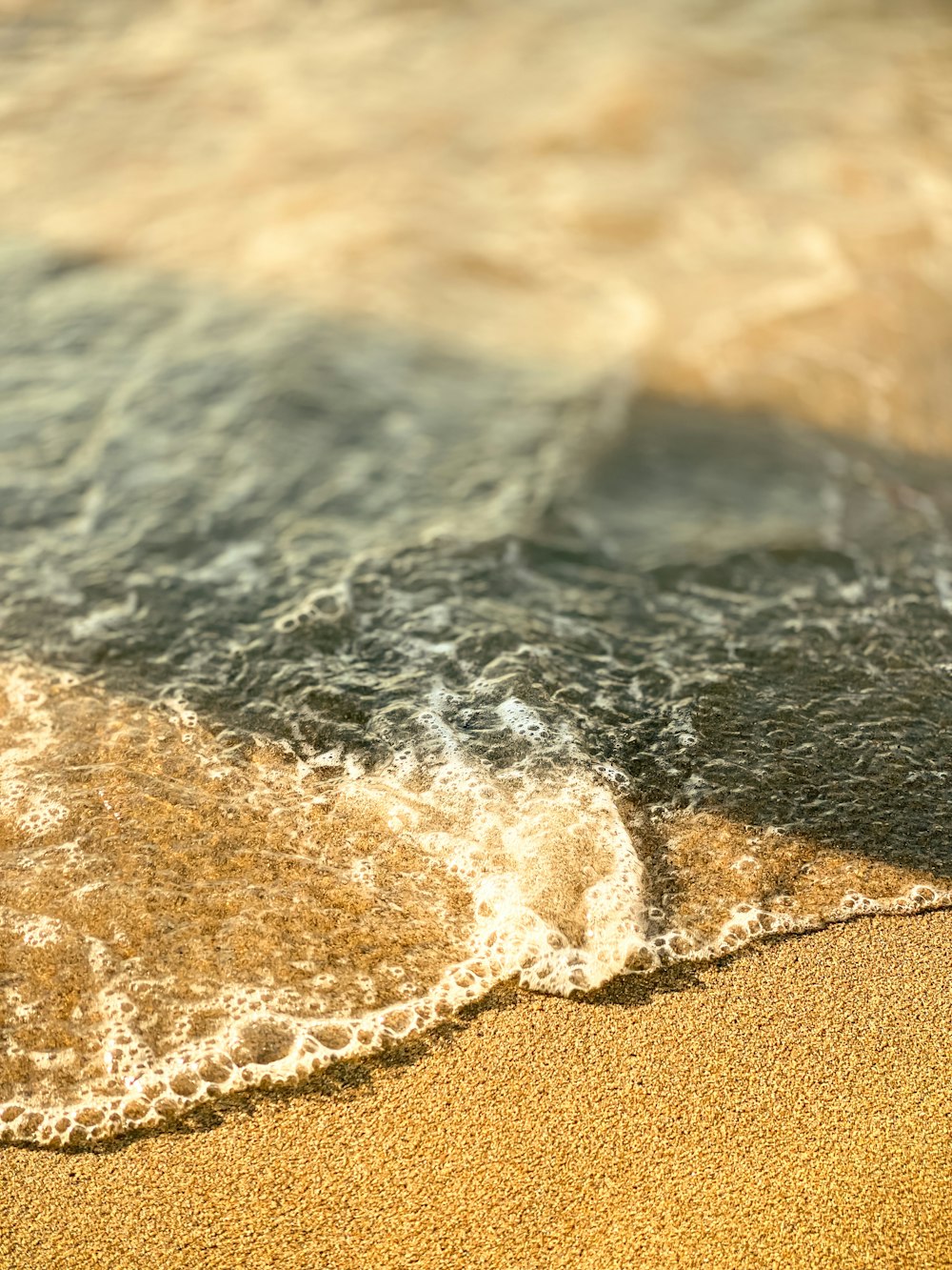 a wave crashing on a beach