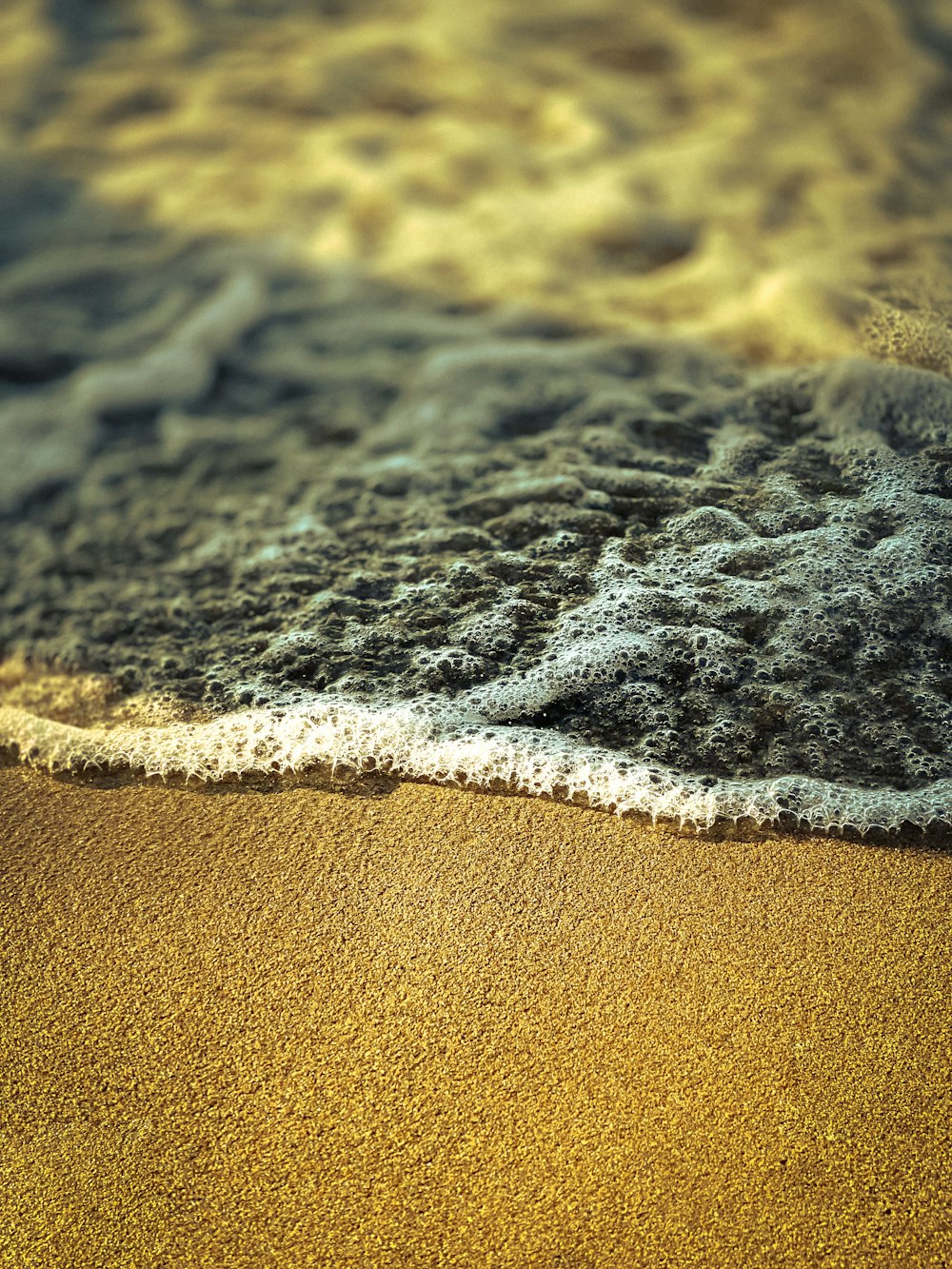 a wave crashing on a beach