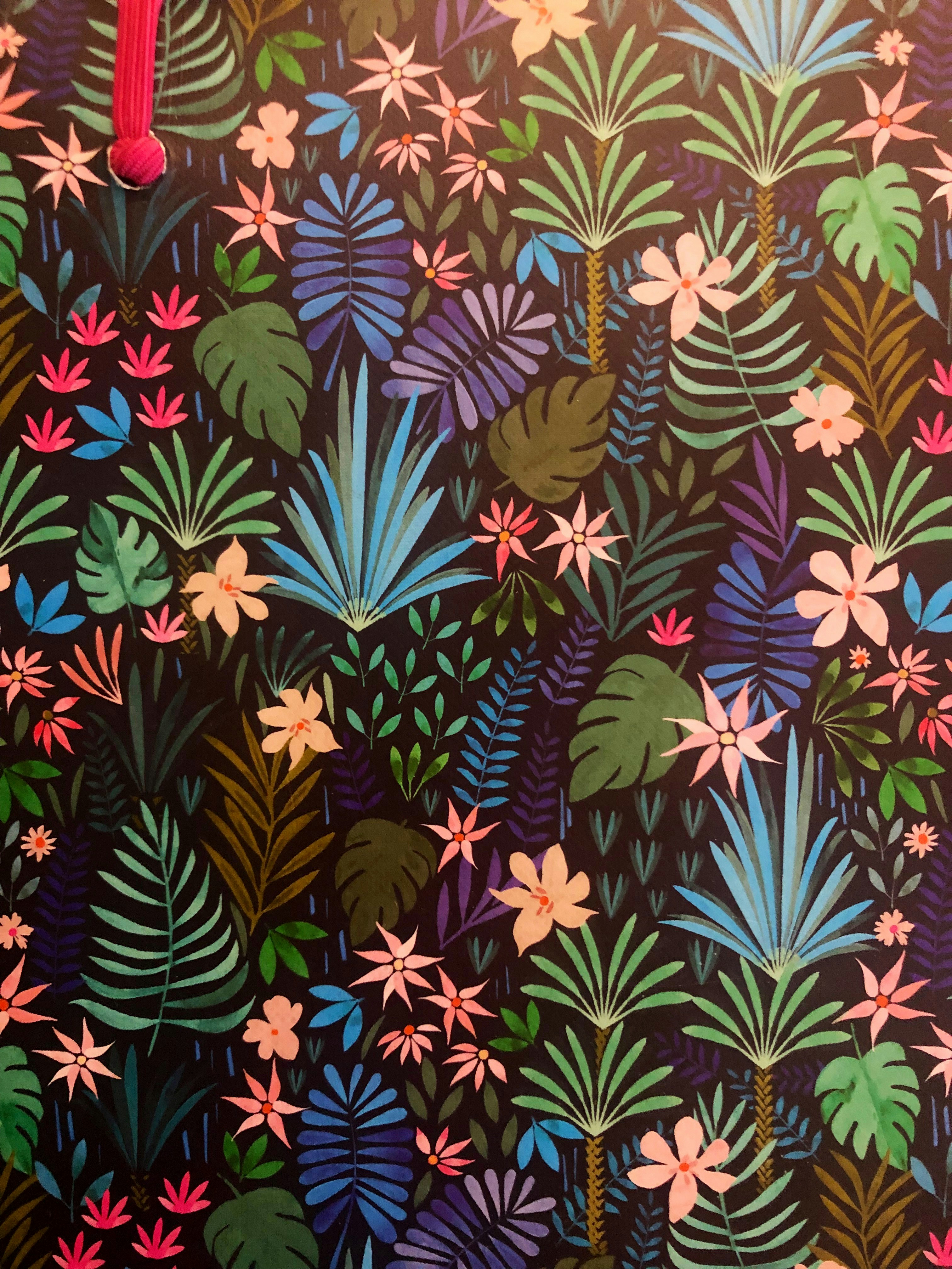Colorful tropical palm leaf toss print with green, mustard, and terracotta tones