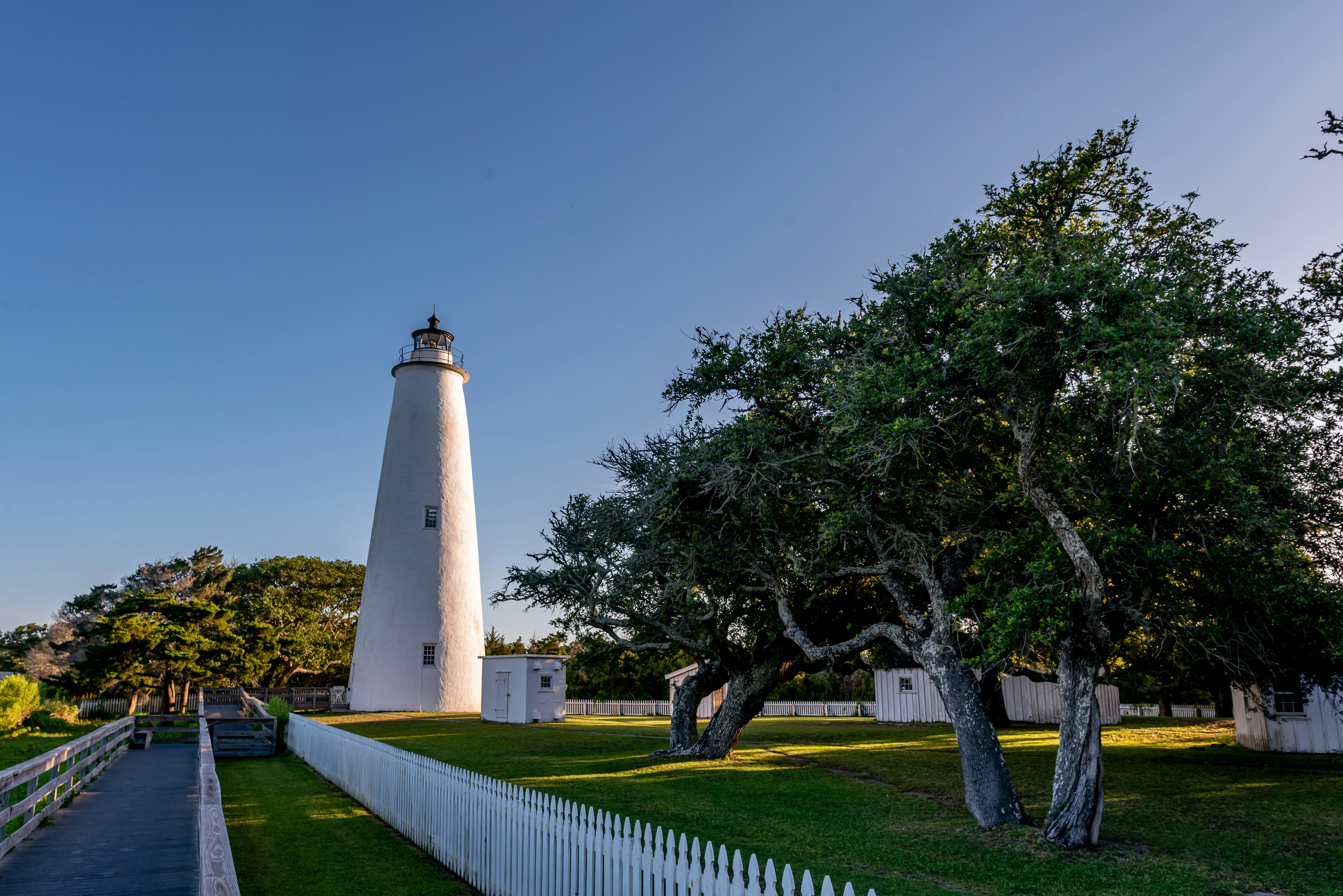 a white tower with a light house
