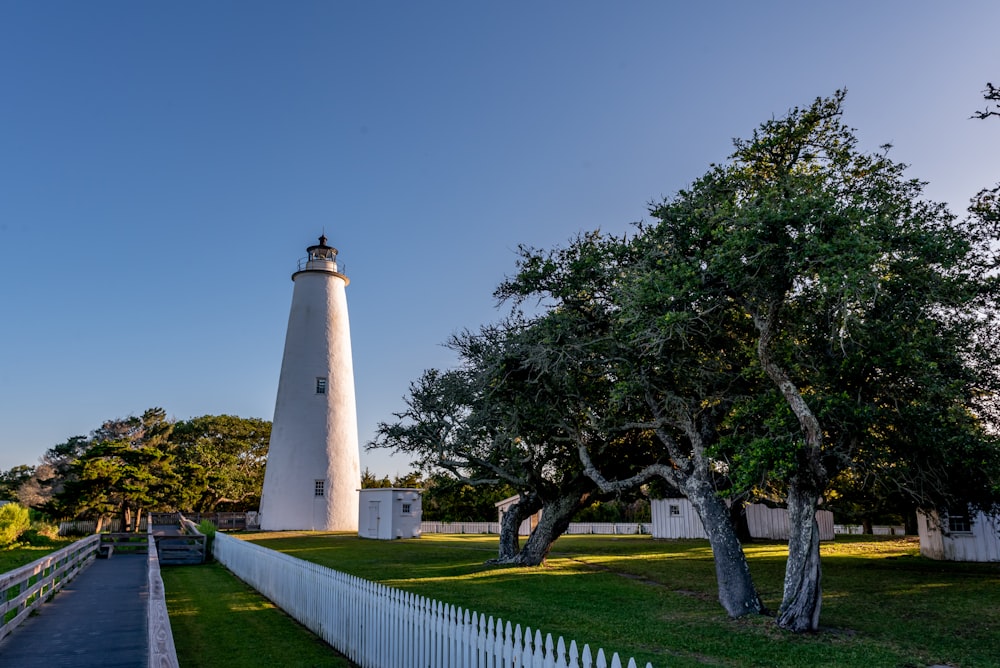 a white tower with a light house