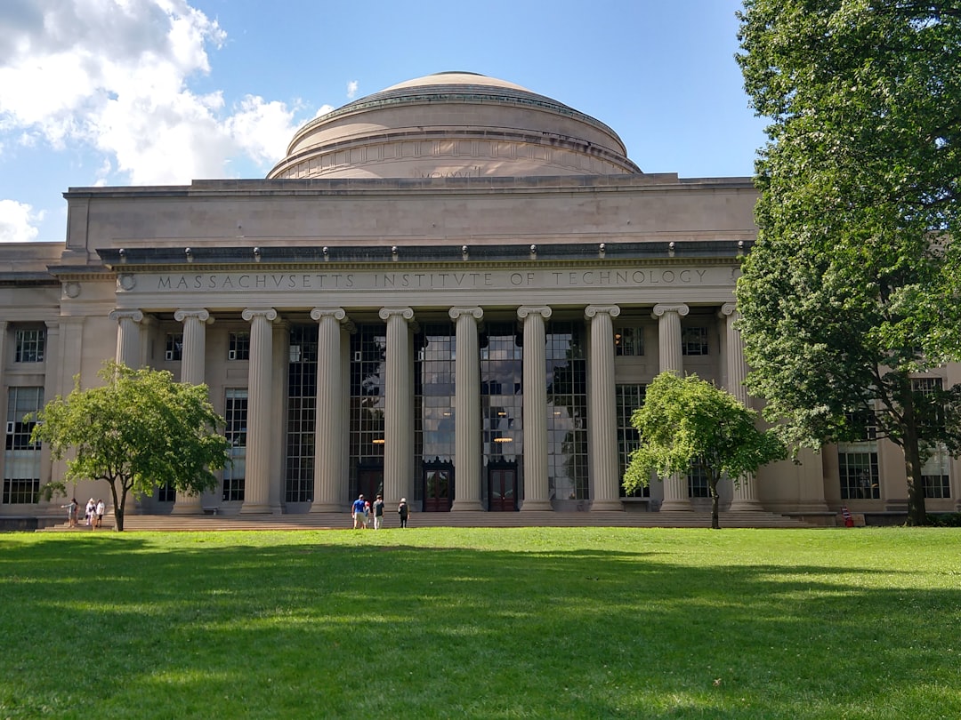 a large white building with columns, MIT