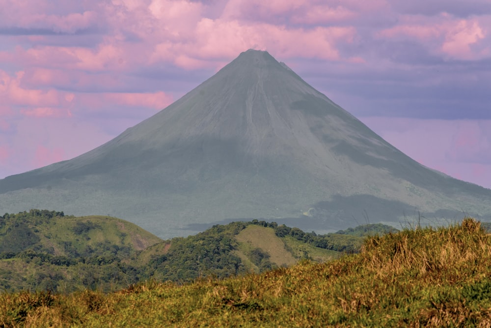 a large mountain with a valley below