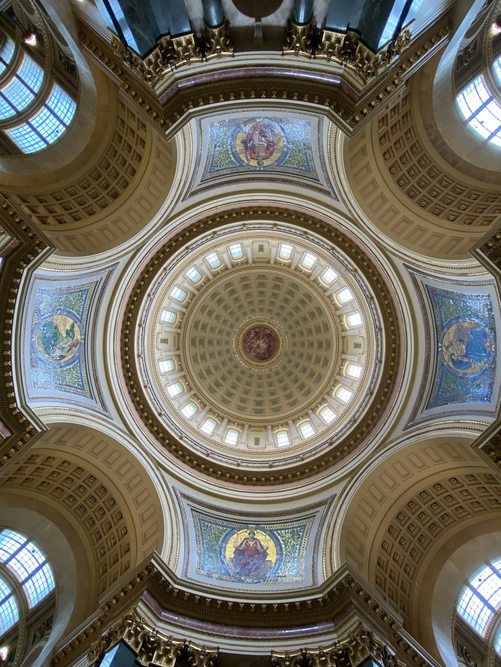 a large ornate ceiling with many windows