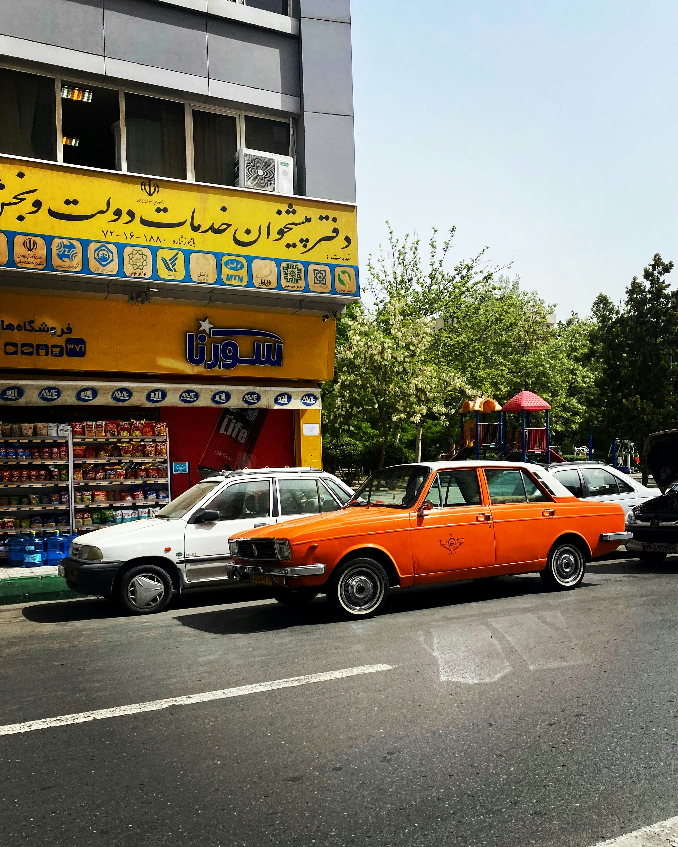 cars parked in front of a store