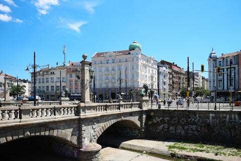 a bridge over a river with buildings on either side of it