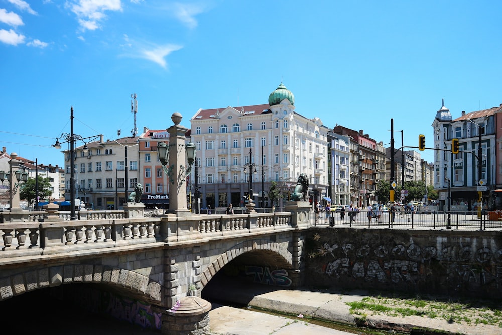 a bridge over a river with buildings on either side of it