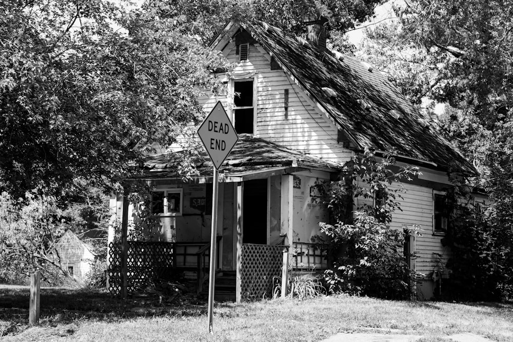 a house with a sign in front of it