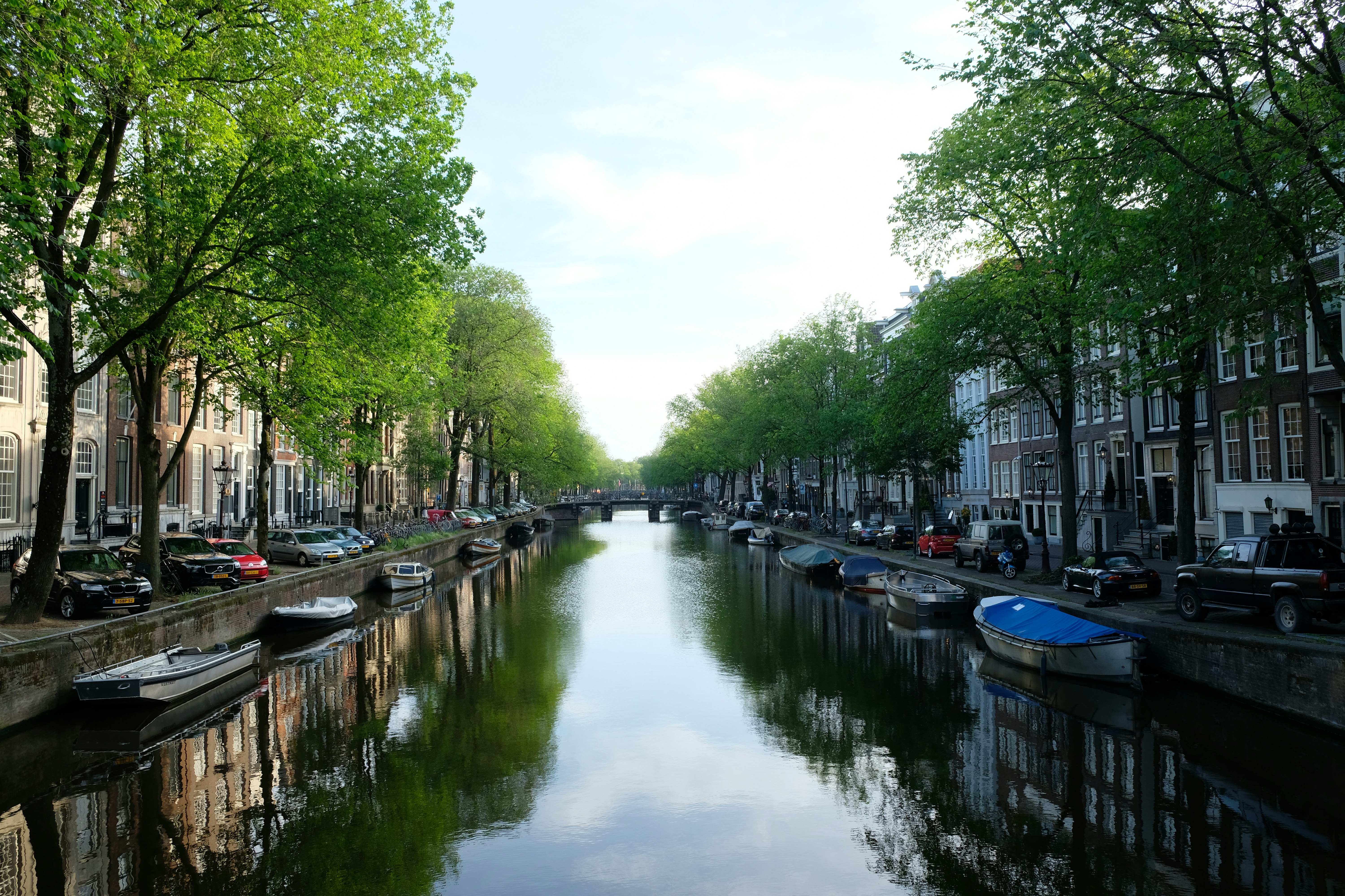 a canal with boats on it with Canal Saint-Martin in the background