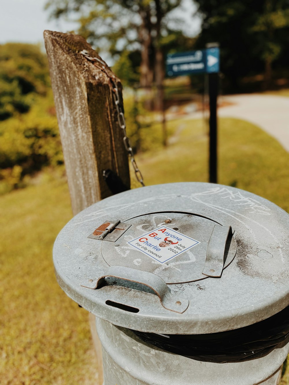 a parking meter is stationed on the side of a street