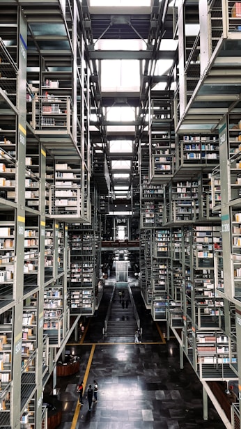 a long hallway with many bookshelves
