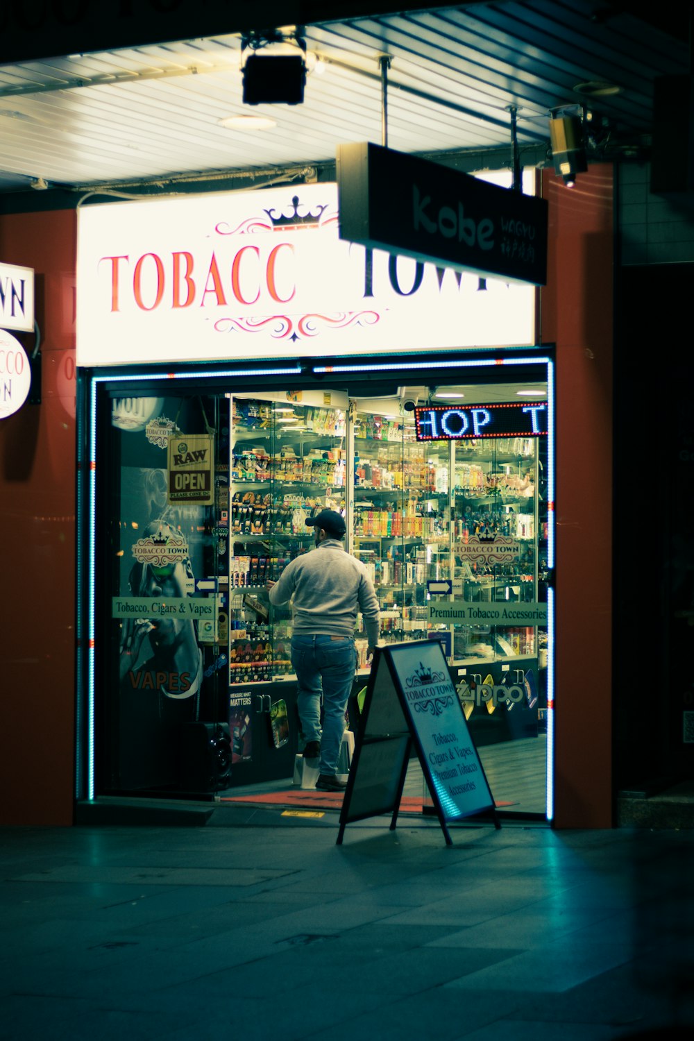 a person standing in front of a storefront