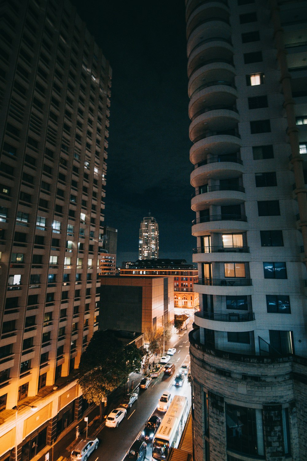 a street between two tall buildings