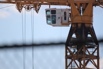 Close-up of engineers inspecting tower blueprints on site.