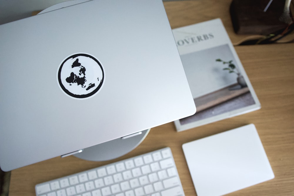 a book and a keyboard on a desk