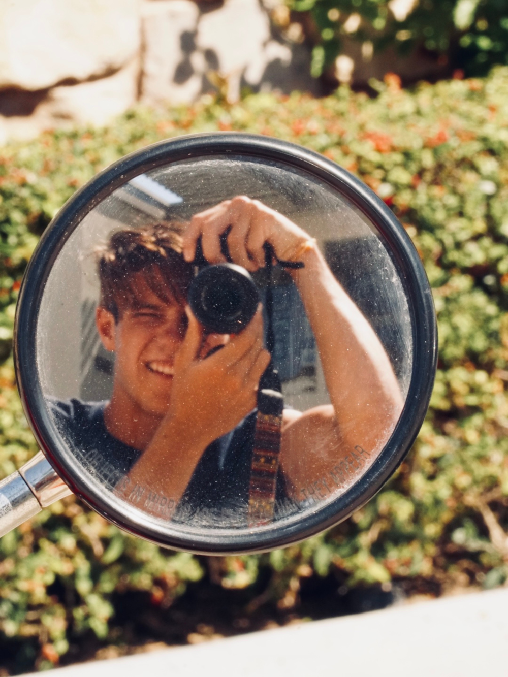 a person taking a selfie in a mirror