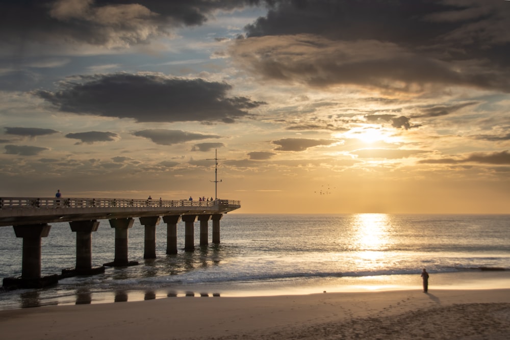 a pier with people walking on it