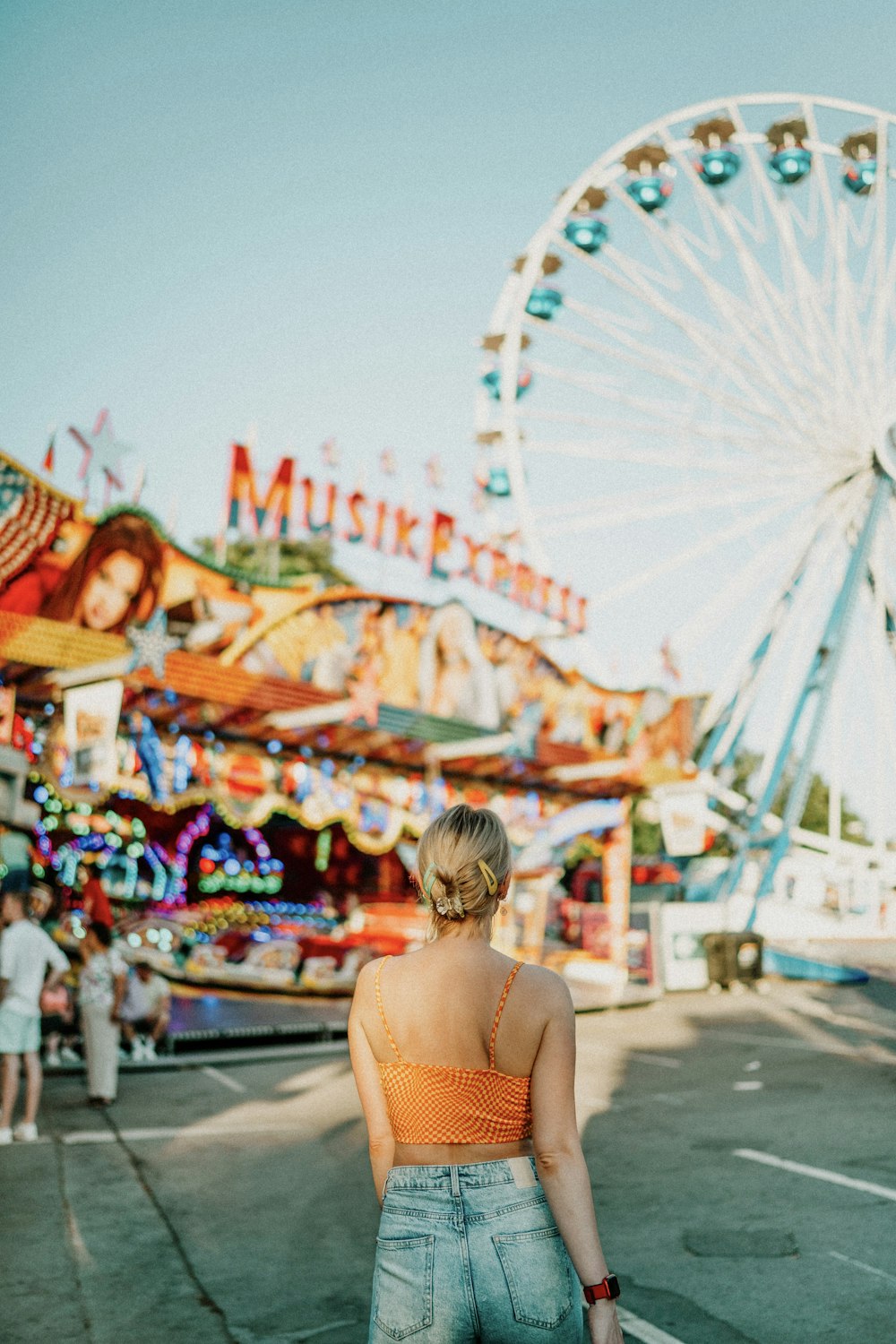 a person looking at a carnival ride