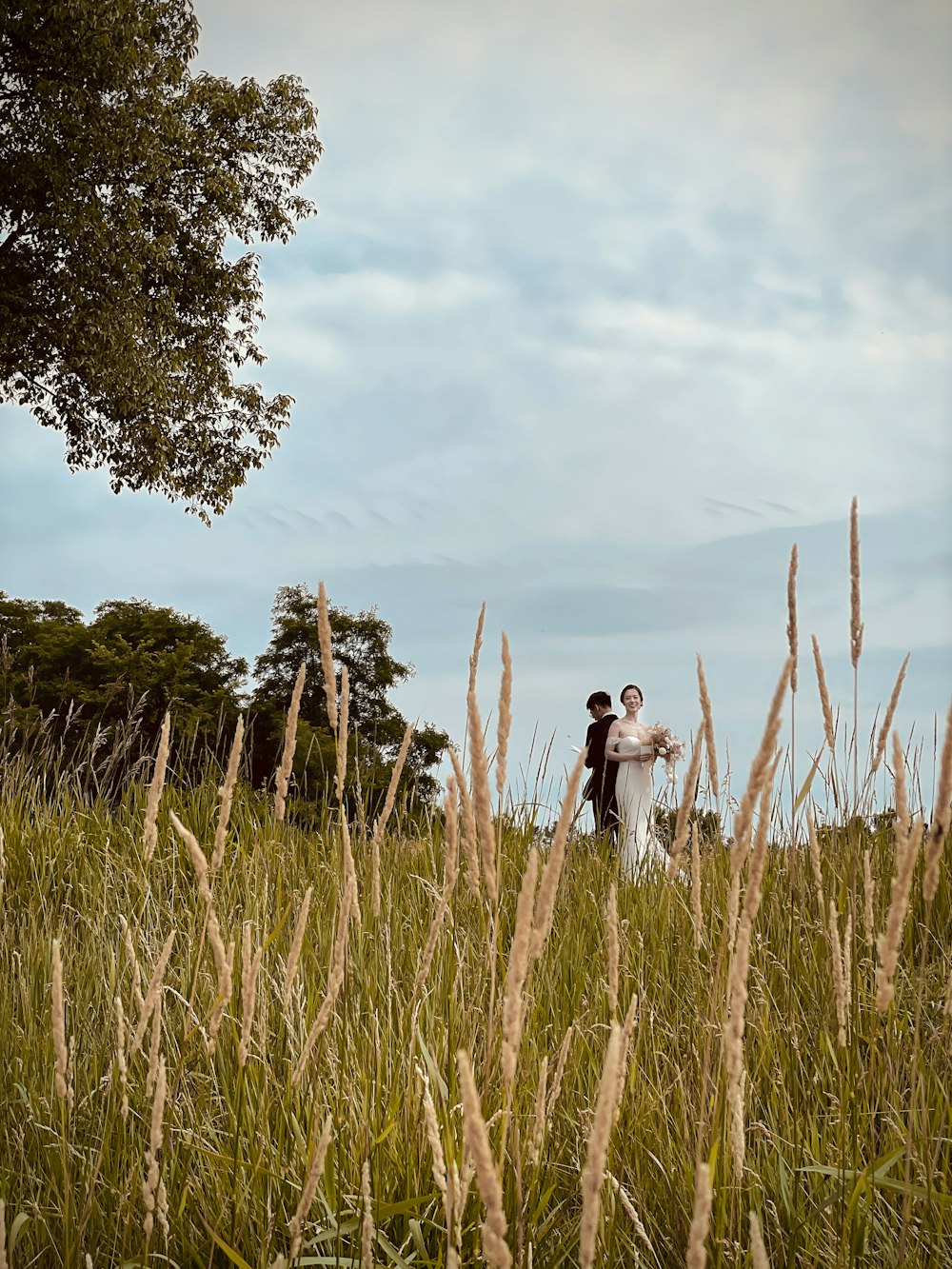 a man and woman in a field