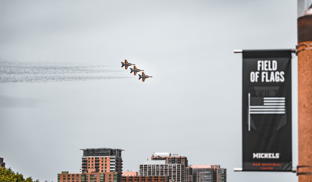 a group of planes flying in the sky