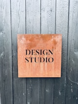 a sign on the side of a wooden door