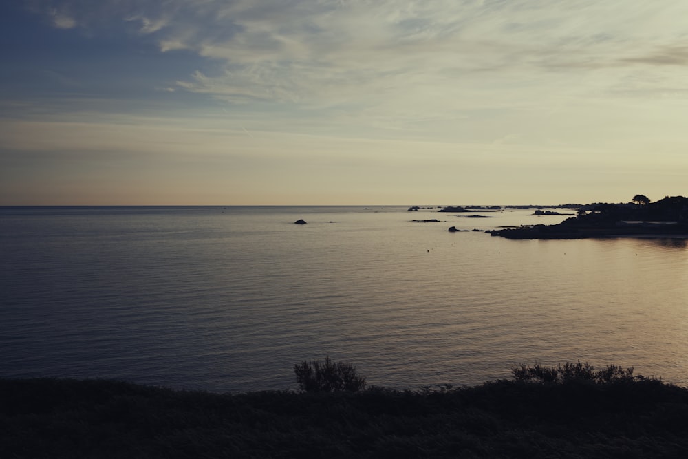 a body of water with land in the distance