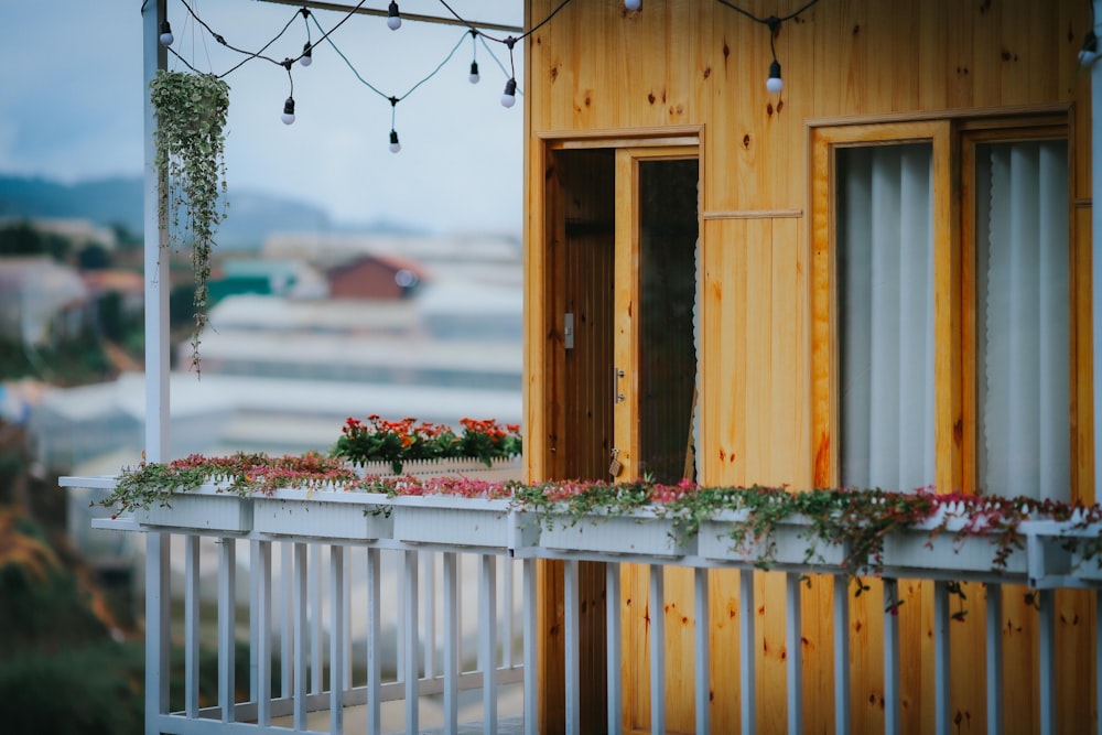 a balcony with flowers