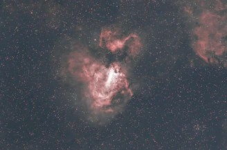 A glowing natal chart overlaid on a deep cosmic nebula with stars and galaxies.