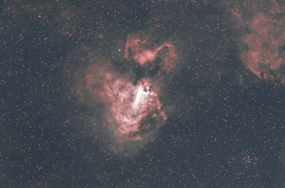 A glowing natal chart overlaid on a deep cosmic nebula with stars and galaxies.