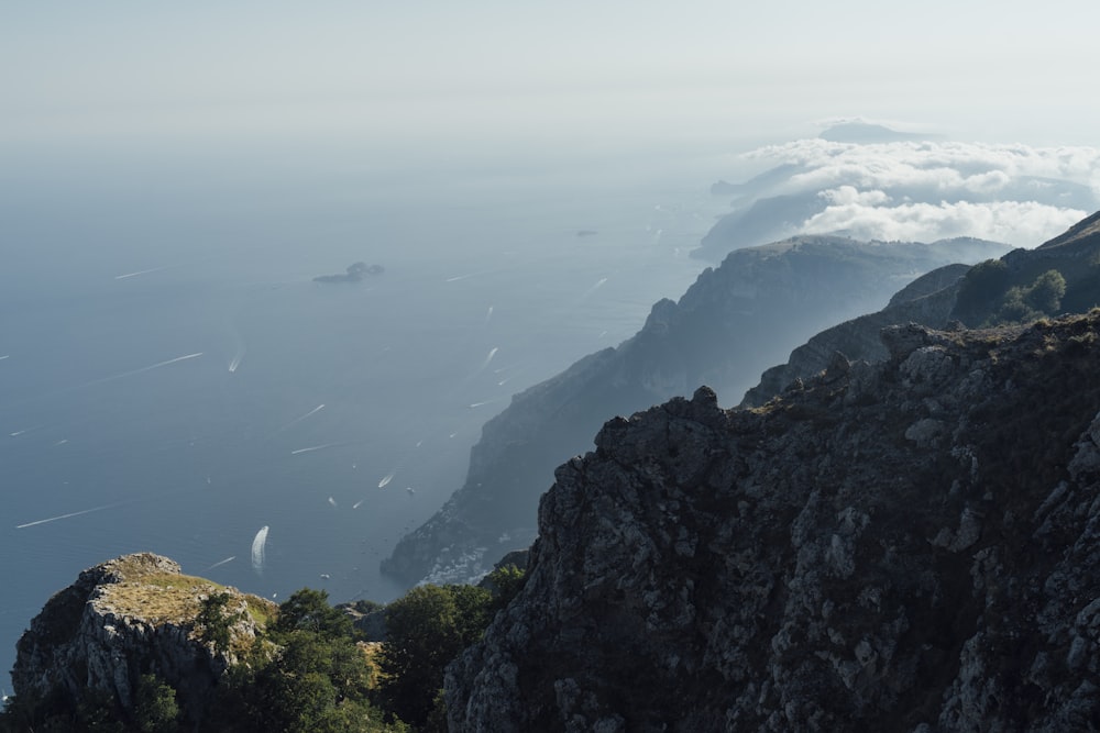 a cliff with a body of water below