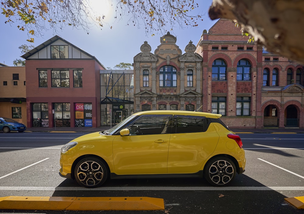 a yellow car on a street