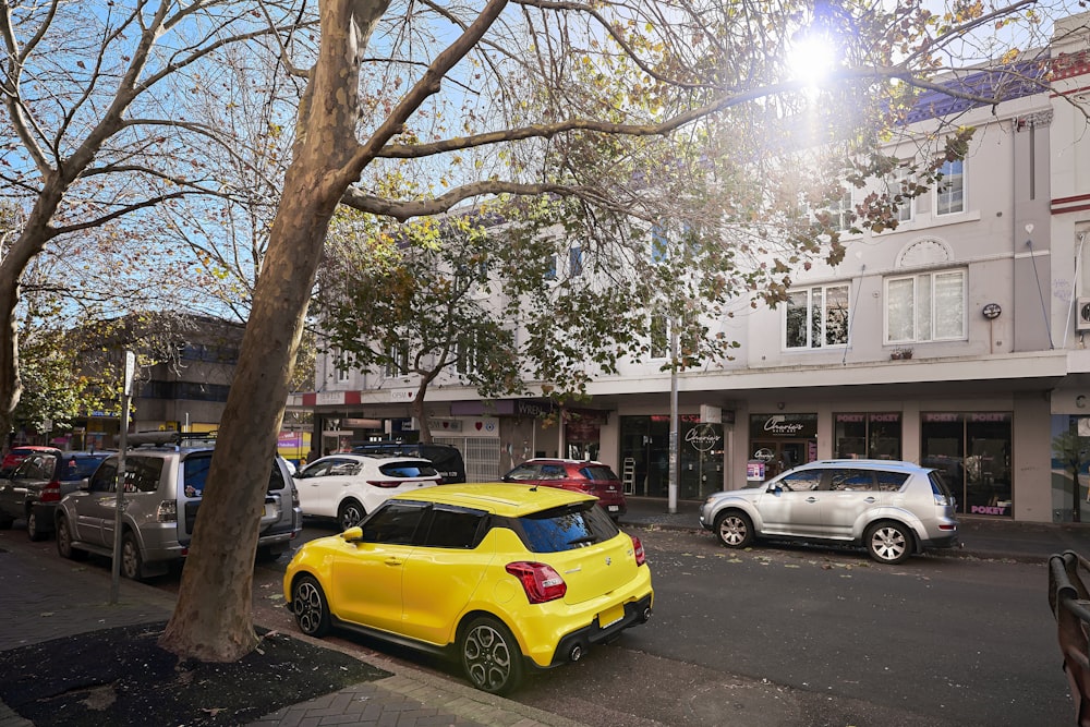 a yellow car parked on the side of a street