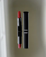 Close-up of the signature red-gold packaging reflecting the brand’s elegant color palette.