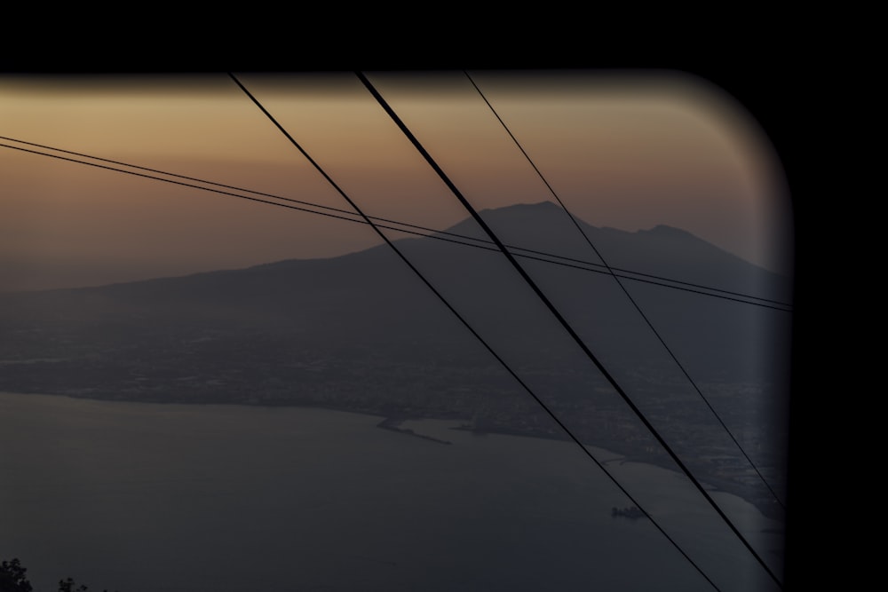 a view of a mountain range from a window