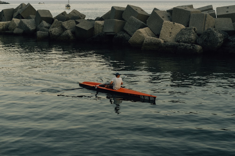 a person in a canoe in a body of water