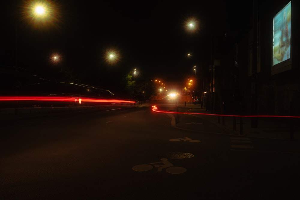 a road with a car on it and a street light on the side