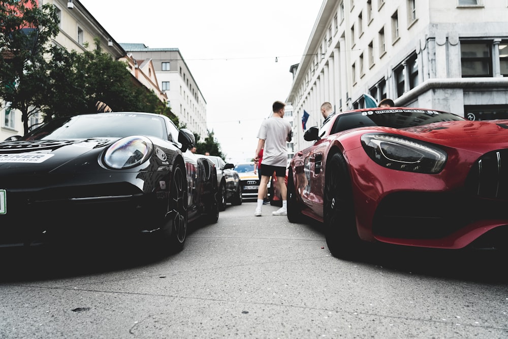 a person walking next to a row of cars