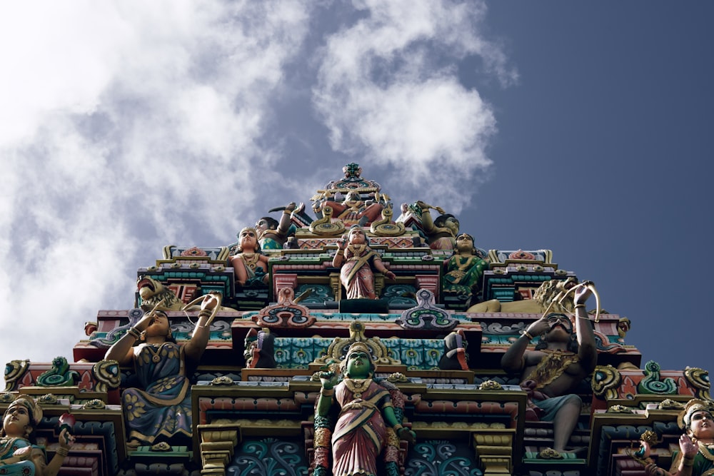 a group of people in garment with Sri Mariamman Temple, Singapore in the background
