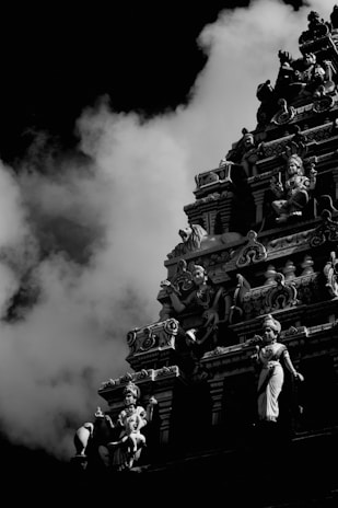 a large building with a large cloud of smoke behind it