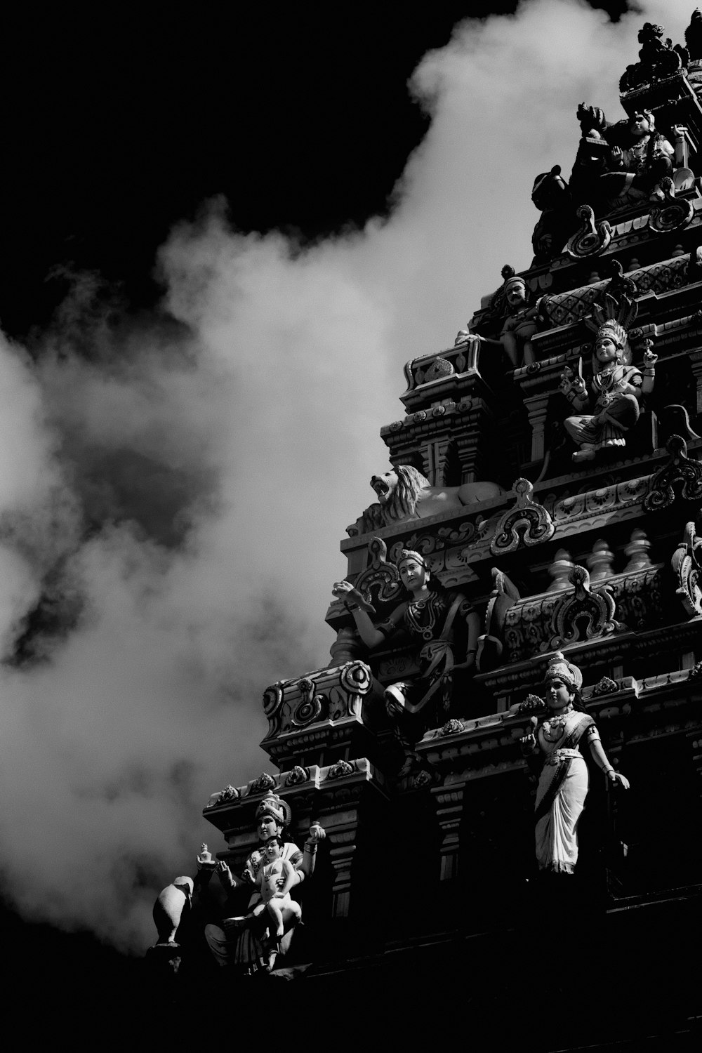 a large building with a large cloud of smoke behind it