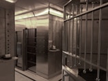 Interior view of a secure vault room with multiple safes.