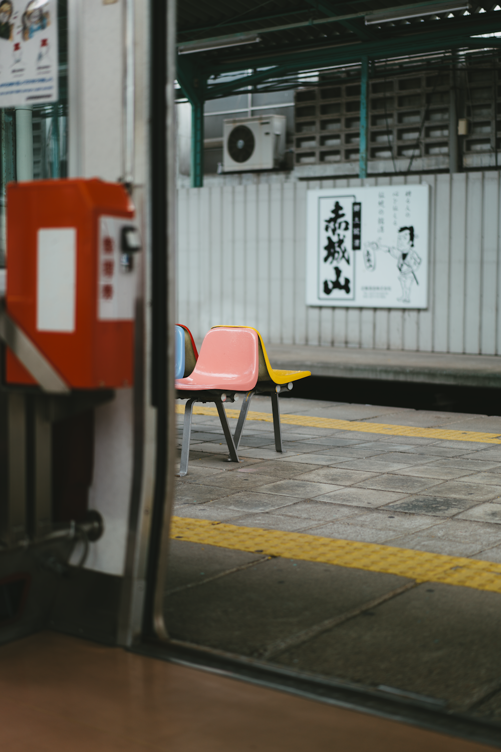 a red chair in a parking lot