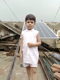 A young girl proudly presenting a solar-powered model she built as part of BIOSI Global’s educational outreach.