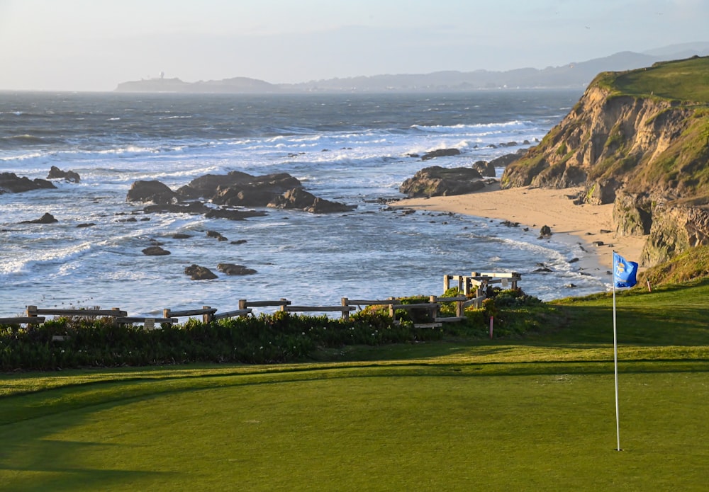 a golf course next to a beach