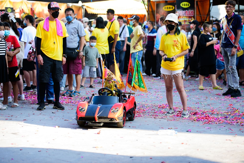 a crowd of people watching a race car