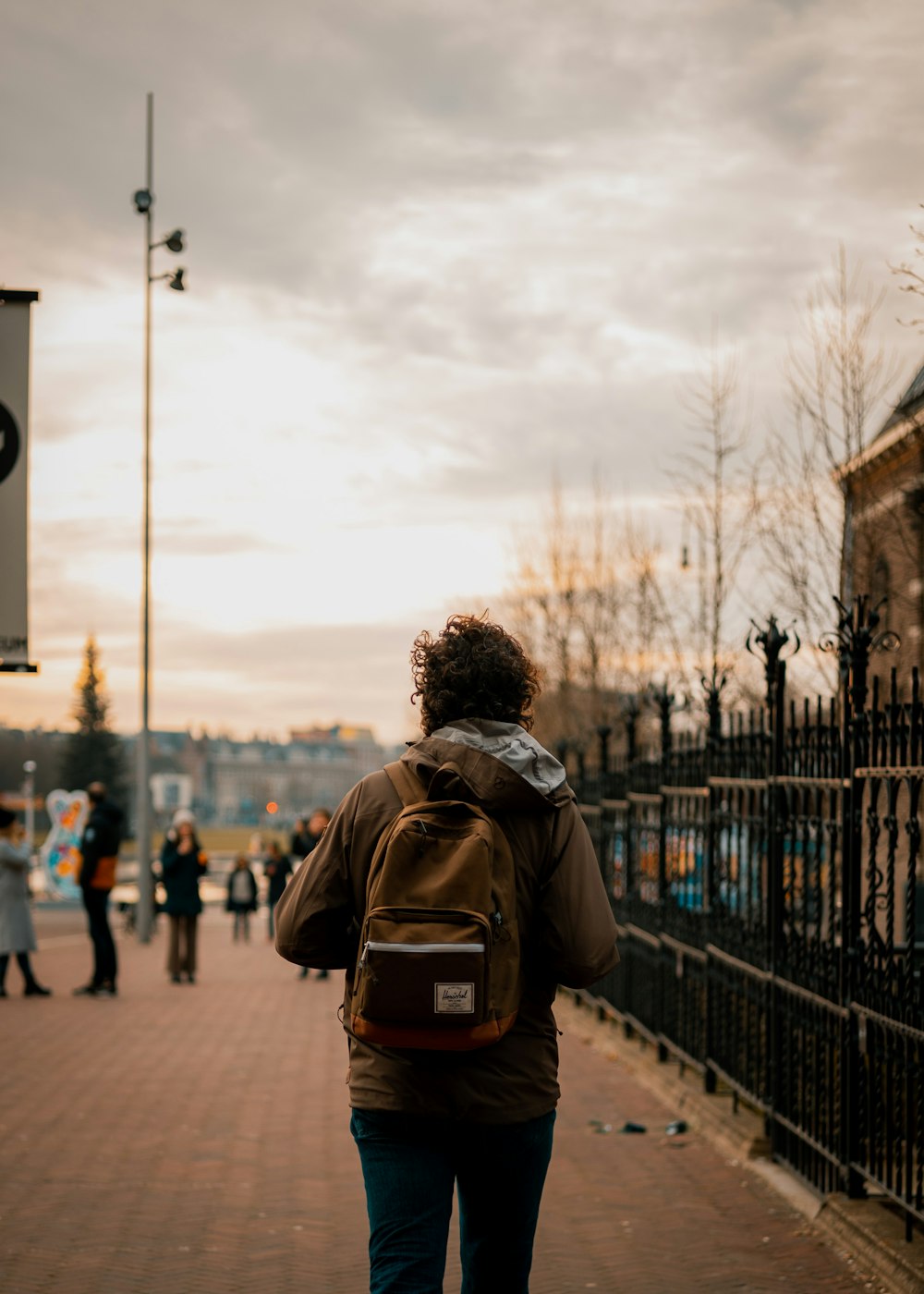 a person walking on a sidewalk