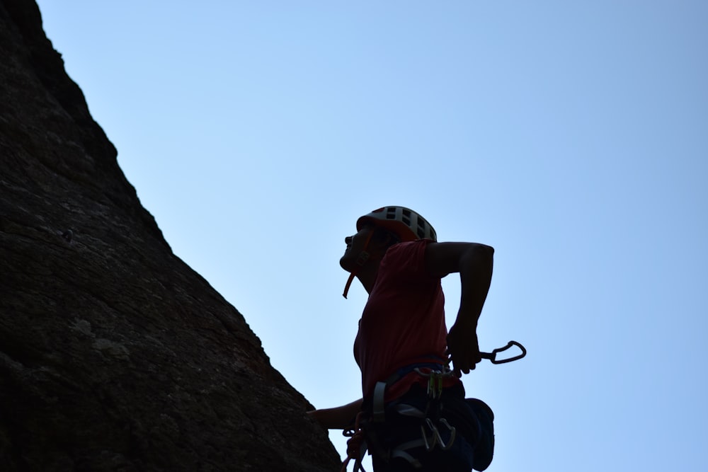 a man climbing a rock