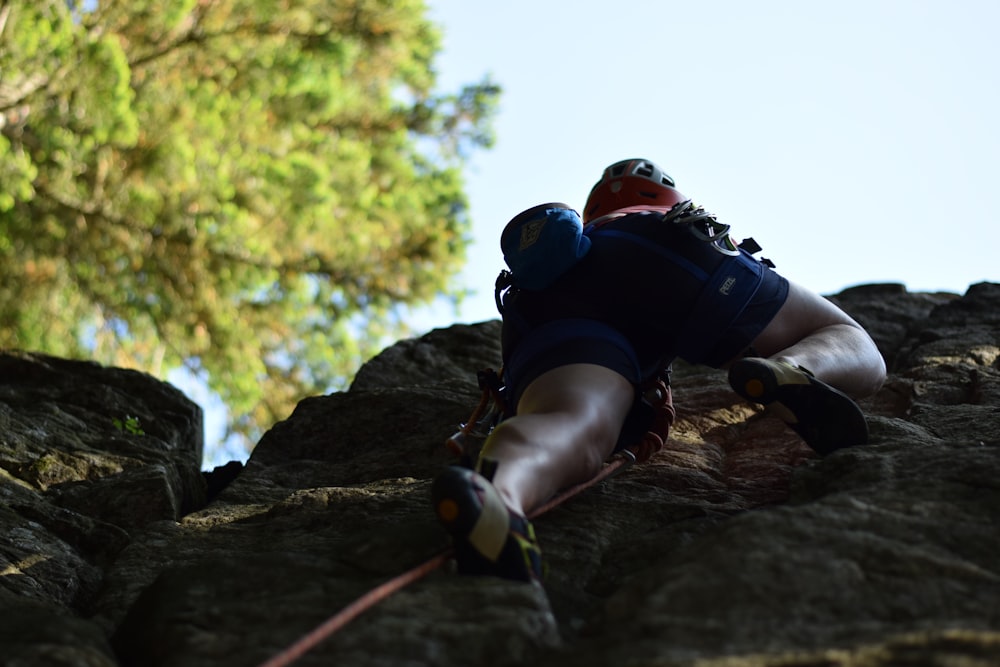 a man climbing a rock